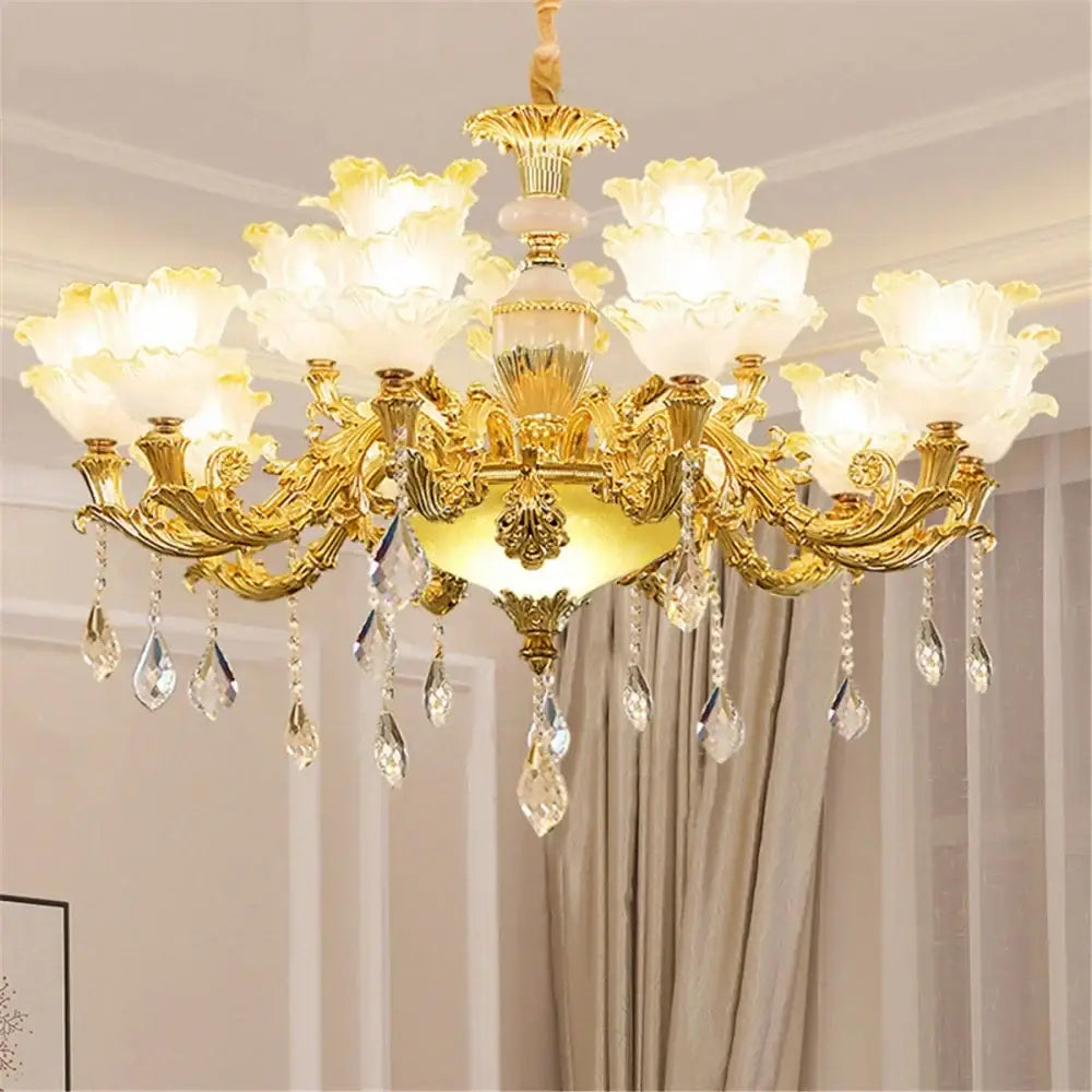 Gold-toned decorbites elegant crystal chandelier with floral arms, frosted flower shades, and blue crystal pendants for living room lighting