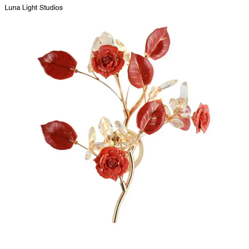 Elegant gold branch wall lamp with delicate red rose brooch and clear crystal accents for direct wired electric sconce lighting