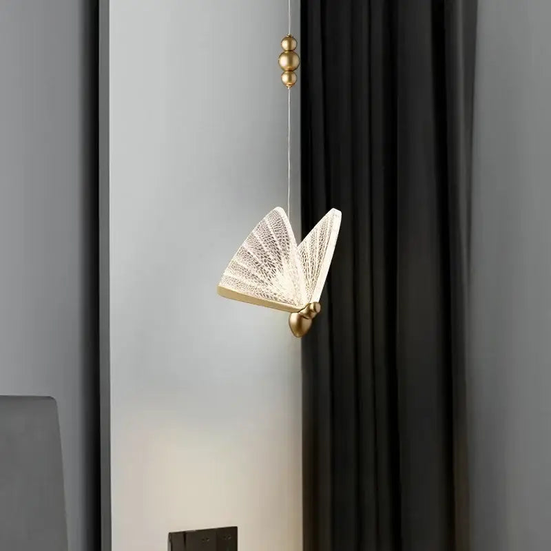 Elegant gold butterfly led pendant light featuring translucent patterned wings and delicate hanging chain for decorbites decorbites butterfly led pendant