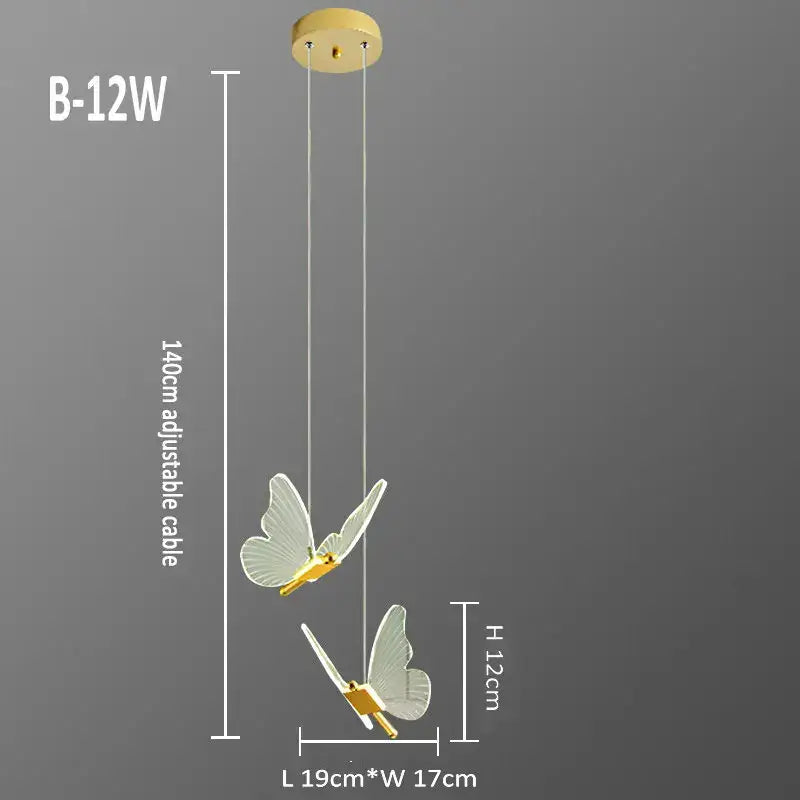 Elegant gold butterfly pendant lamp with translucent wings suspended by adjustable cable from wooden ceiling mount