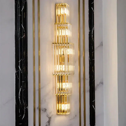 Elegant gold crystal wall lamp featuring stacked metallic cylindrical elements for living room decorbites crystal wall lighting