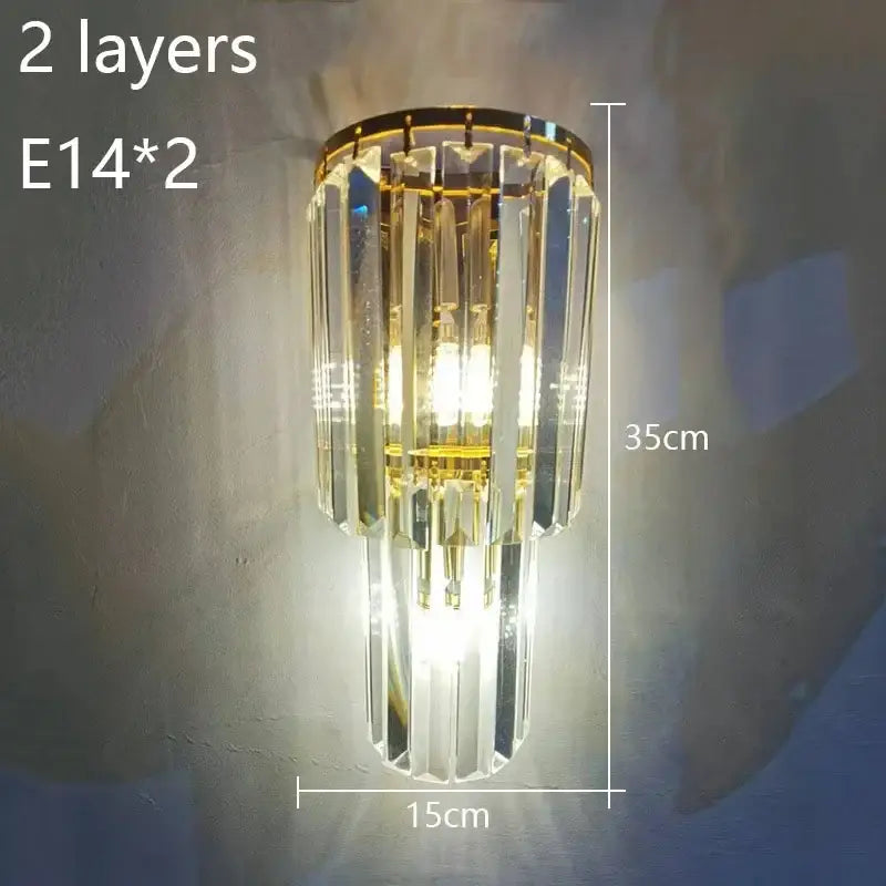 Elegant gold wall lamp featuring two tiers of faceted crystal prisms for living room decorbites crystal wall lamp