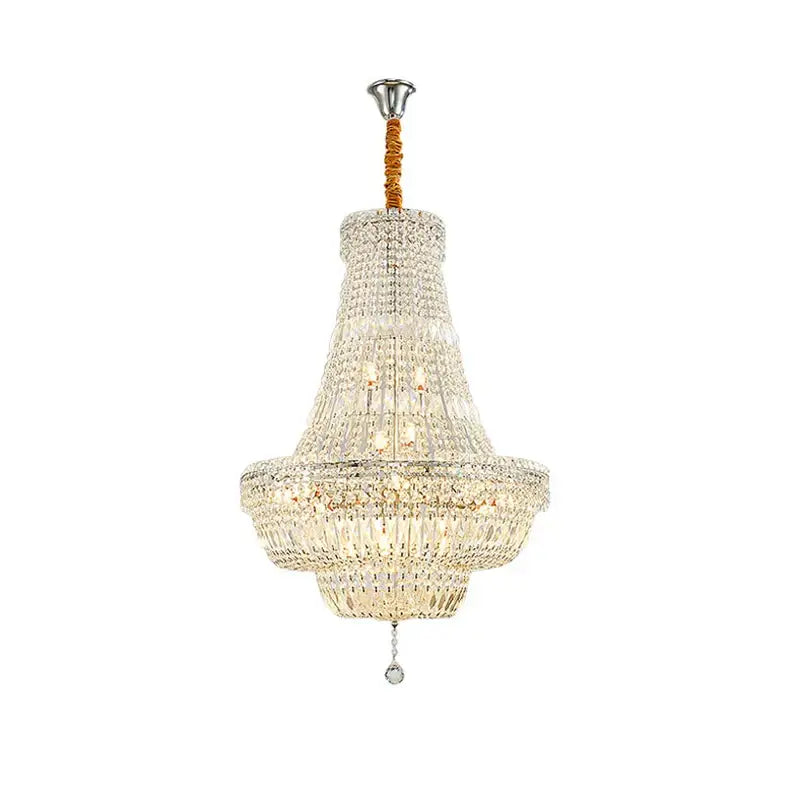 Elegant gold and chrome k9 crystal chandelier with multi-tiered polished chrome finish and warm fabric suspension for dining room decor