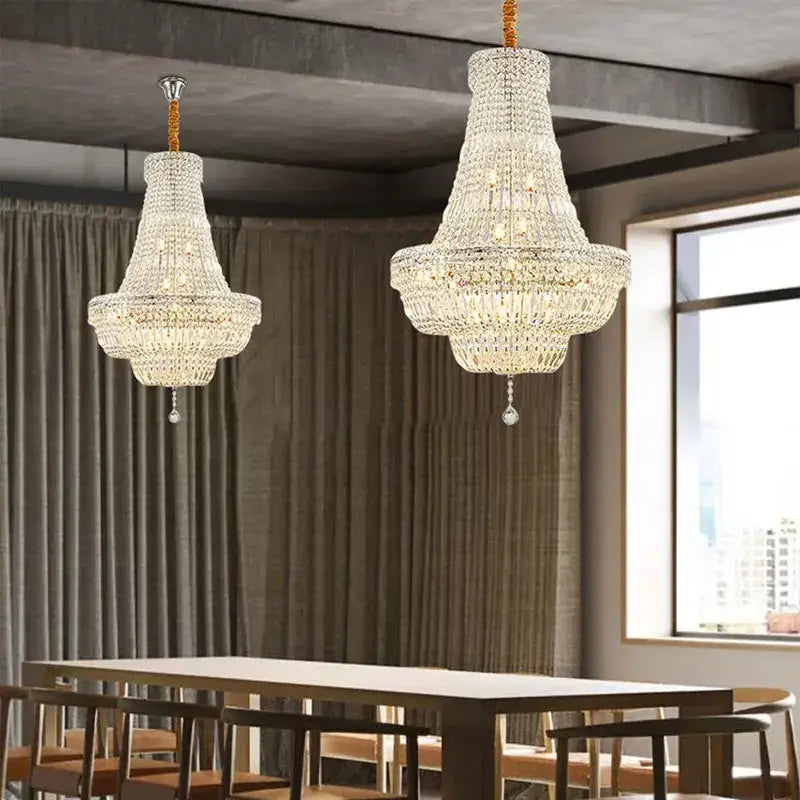 Two elegant gold and chrome k9 crystal chandeliers with multi-tiered design hang for dining room decorbites crystal chandelier