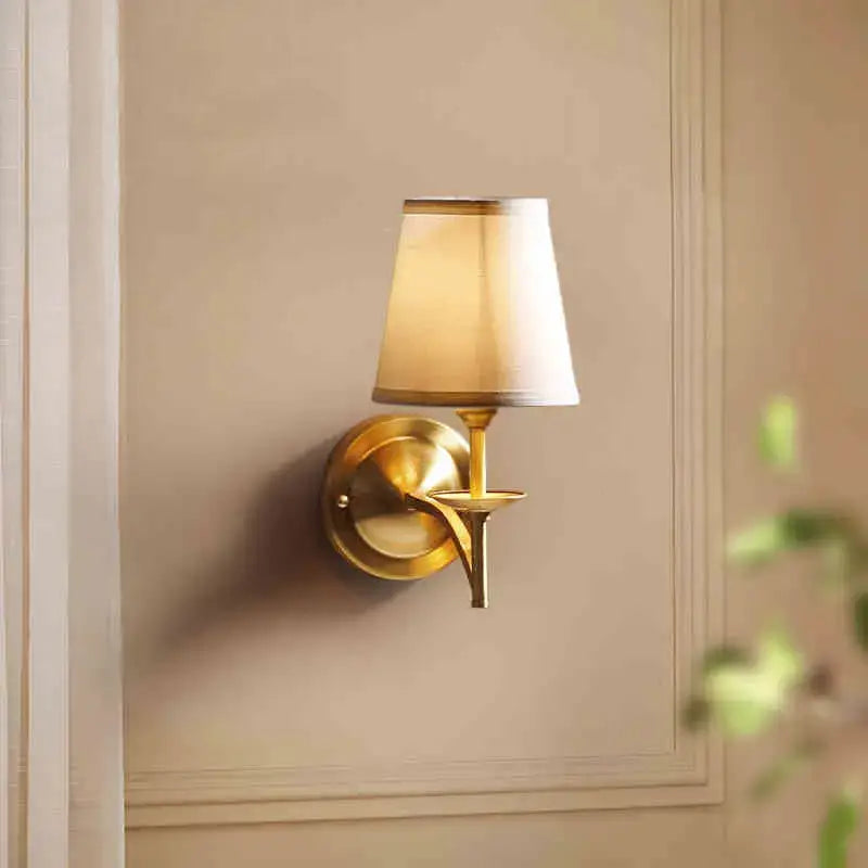 Elegant gold wall lamp with cream fabric shade ideal for bedroom decorbites copper wall lamp lighting solution