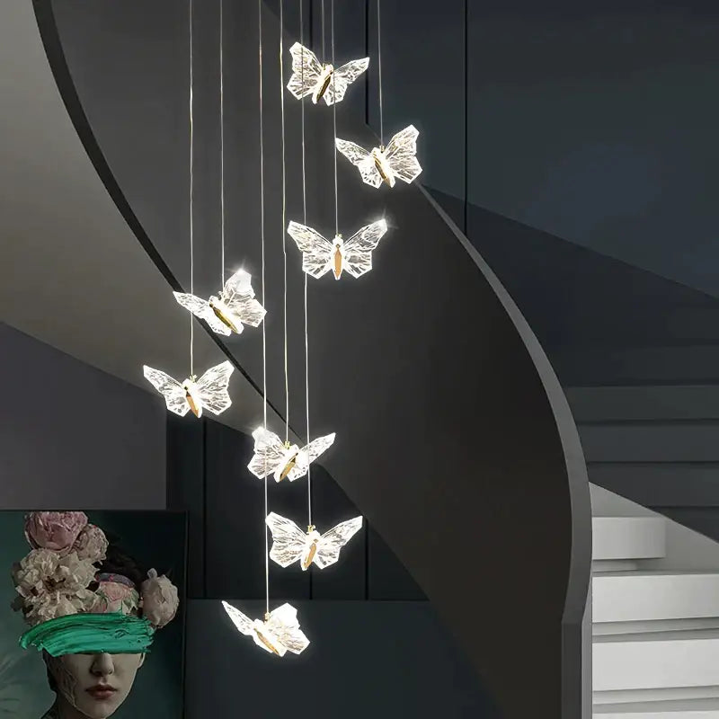 Elegant gold crystal butterfly ladder pendant lights with seven illuminated butterfly-shaped lights for stair decorbites butterfly ladder