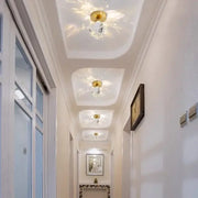 Elegant gold ceiling light fixture with clear crystal pendants designed for hallway entrance lighting