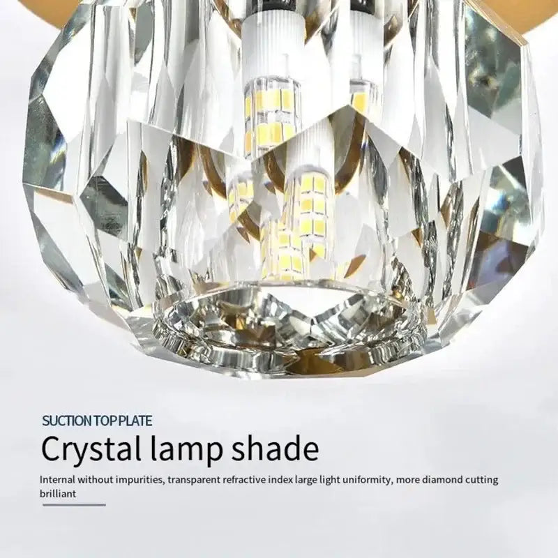 Elegant gold crystal ceiling light fixture with clear faceted crystal lamp shade and internal led bulbs for hallway entrance