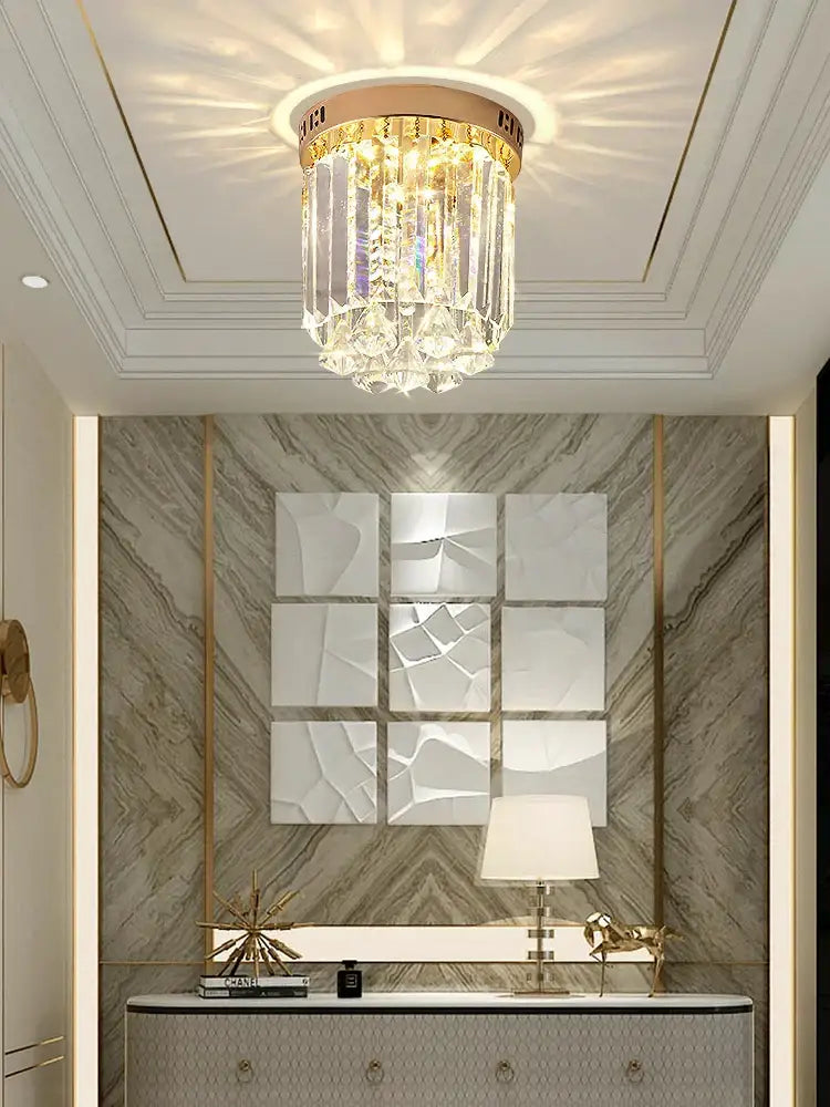 Elegant crystal ceiling light with gold frame and cascading glass prisms for hallway by Decorbites elegant crystal