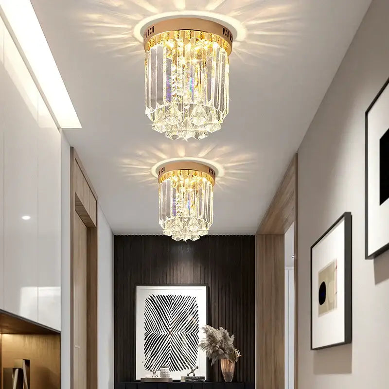 Two elegant gold crystal ceiling lights with cascading clear glass prisms for hallway decorbites elegant crystal design