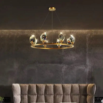 A modern gold-toned pendant light with five faceted crystal pendants for elegant chandelier dining decorbites elegant chandelier