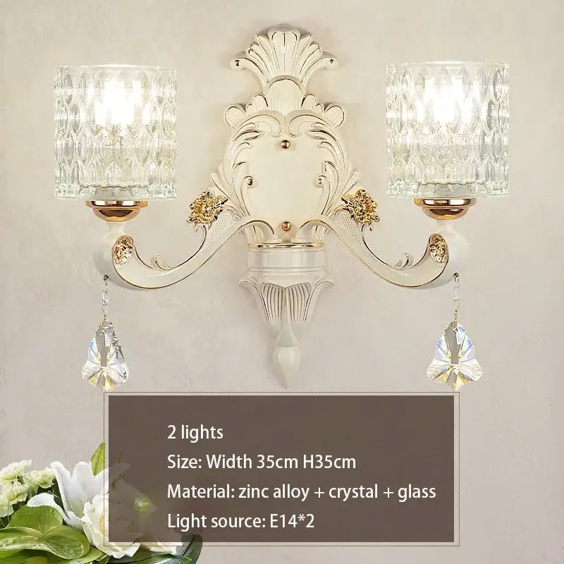 Elegant gold crystal chandelier wall sconce with white and gold ornate design and dangling faceted crystals decorbites elegant crystal