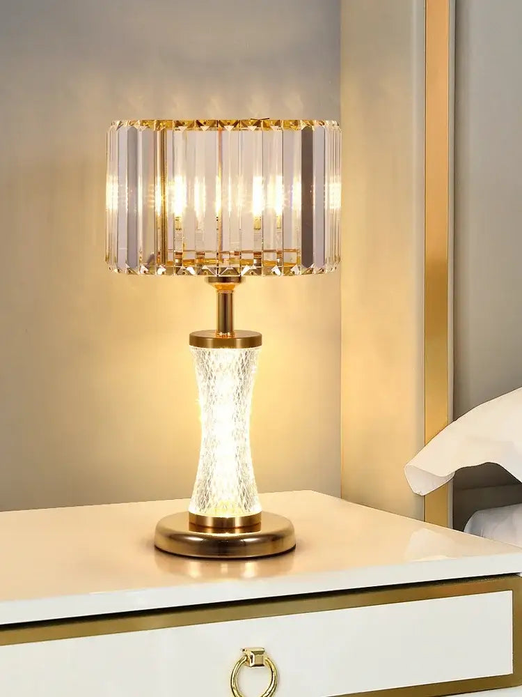 Elegant gold decorbites crystal desk lamp with faceted glass shade and textured illuminated base for bedside lighting