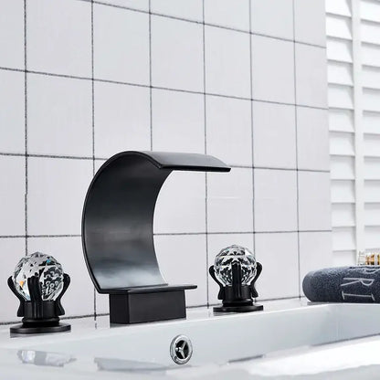Black matte-finish waterfall basin faucet set with crystal globe handles providing elegant bathroom tap design