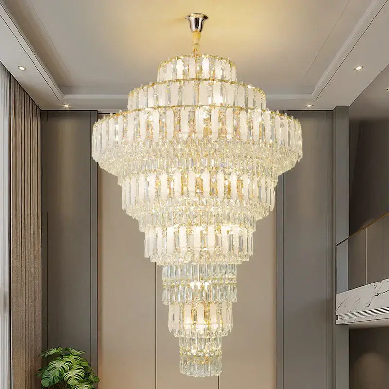 Elegant gold crystal hollow chandelier with cascading clear glass prisms for sophisticated living room lighting