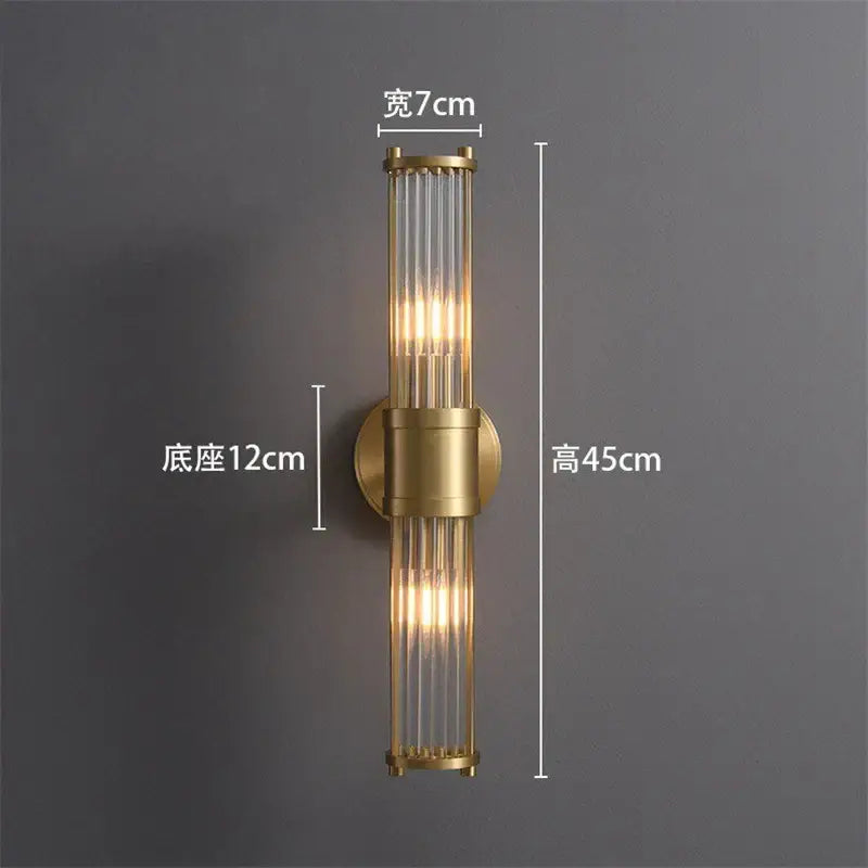 Gold-toned crystal led wall lights with vertical glass tubes and cylindrical brass base for elegant living room decorbites crystal led wall