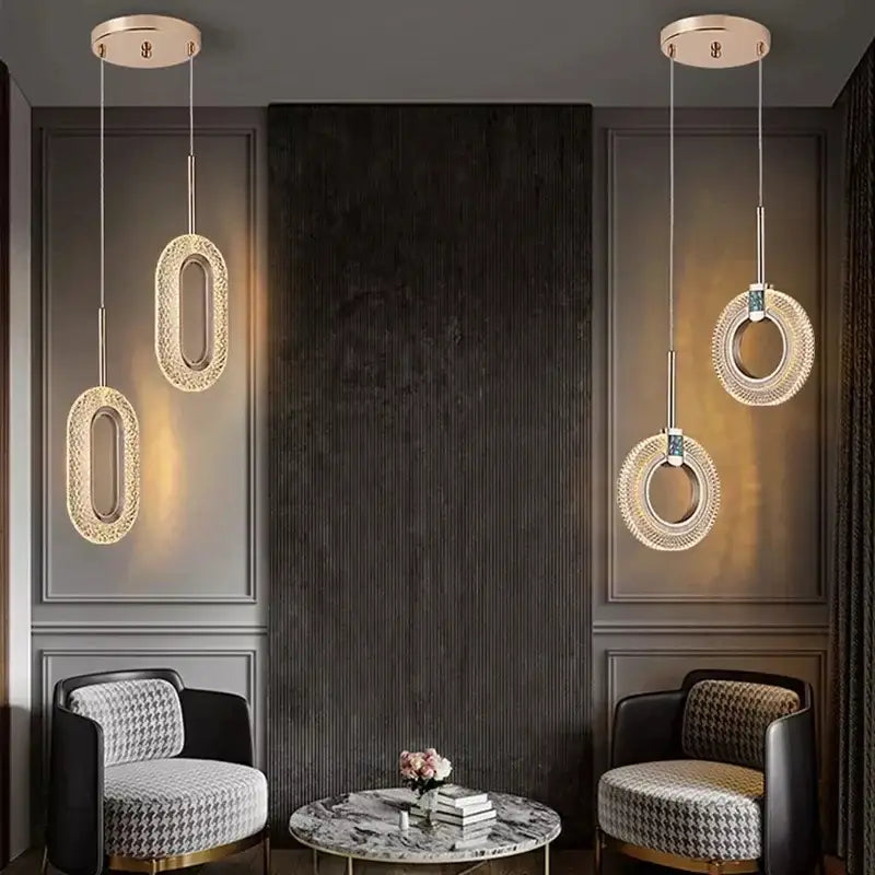 Elegant gold crystal oval pendant light chandelier with sparkling crystals and gold-toned metal fixtures for living room