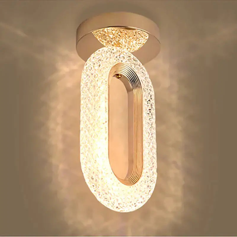 Elegant gold pendant light chandelier with textured crystal shell and ribbed metallic inner design for living room