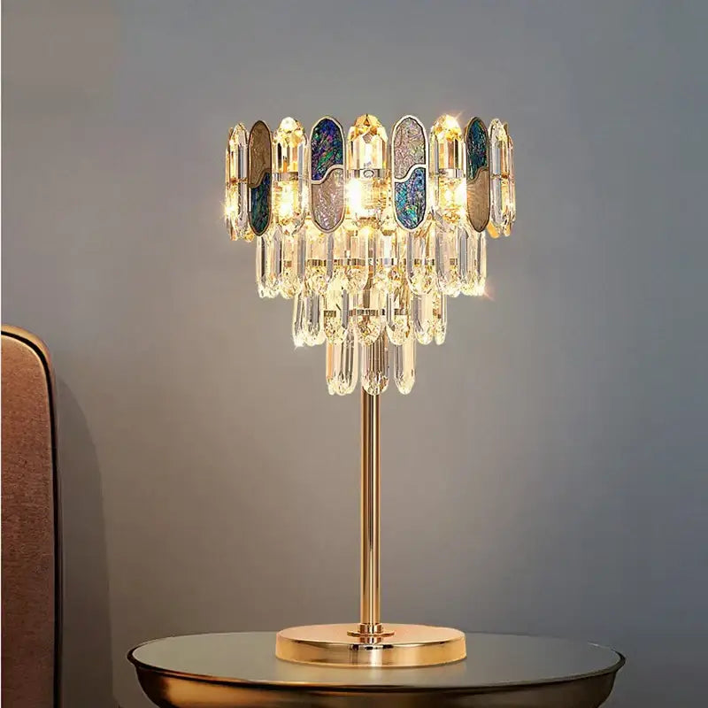 Elegant gold crystal table decor lamp with cascading clear crystal droplets and iridescent panels for bedroom desk light