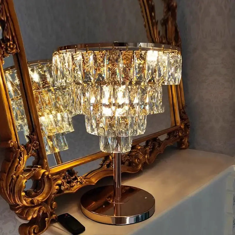Elegant gold crystal table decor lamp with tiered faceted crystals and polished base for bedroom desk lighting