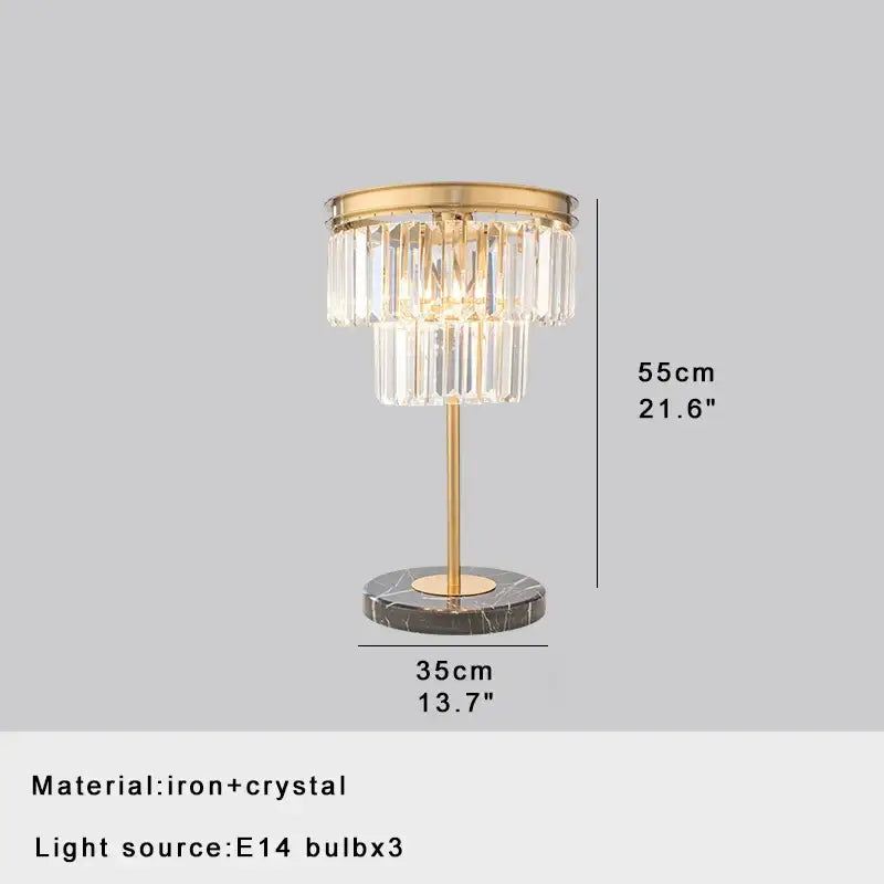 Elegant gold crystal table decor lamp with cascading crystal tiers and dark marble base for bedroom desk lighting