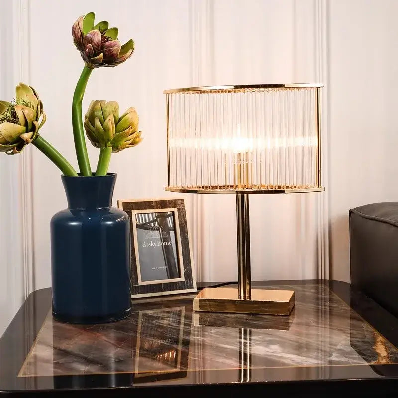 Elegant gold decorbites crystal table lamp with cylindrical glass shade and square base for bedroom desk light