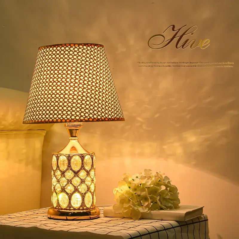 Elegant gold crystal table lamp with perforated beige shade and crystal-encrusted base for bedroom decorbites crystal table