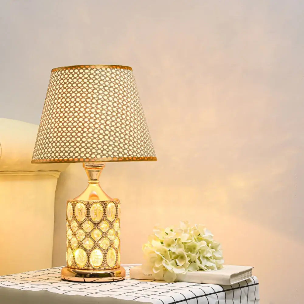 Elegant gold crystal table lamp with patterned mesh shade and ornate base for bedroom ambiance decorbites crystal table