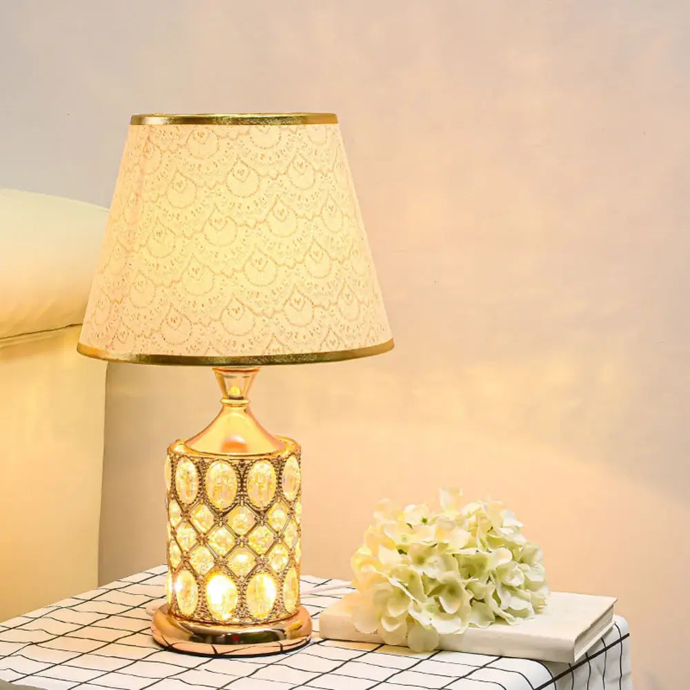 Elegant gold crystal table lamp with beaded oval ceramic body and lace-like shade for bedroom decorbites crystal table ambiance