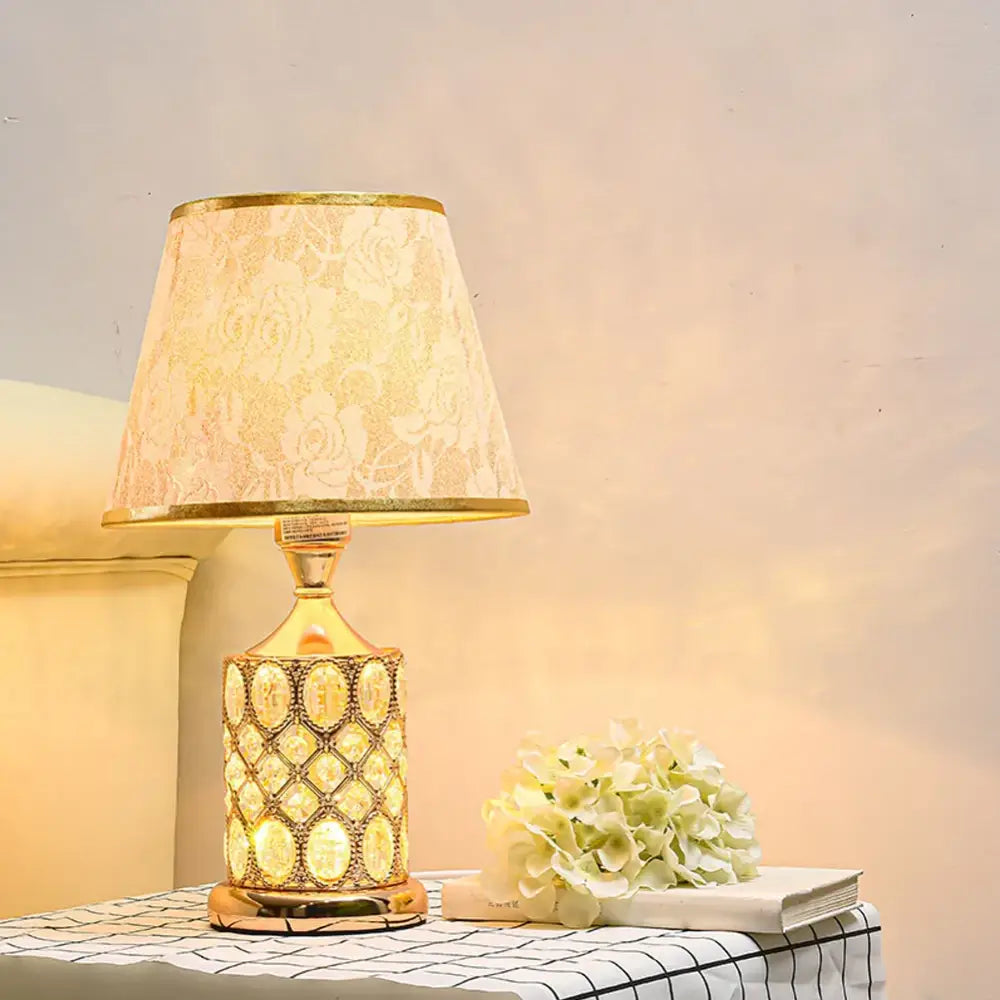 Elegant gold crystal table lamp with a decorative crystal-encrusted base and cream lace shade for bedroom ambiance decorbites crystal table