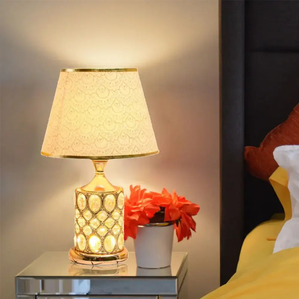 Elegant gold crystal table lamp with a textured fabric shade and ornate crystal-encrusted base for bedroom decorbites crystal table lamp