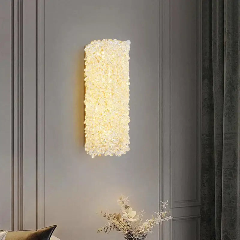 Elegant gold crystal wall lamp featuring a rectangular decorbites crystal wall sconce emitting warm golden light