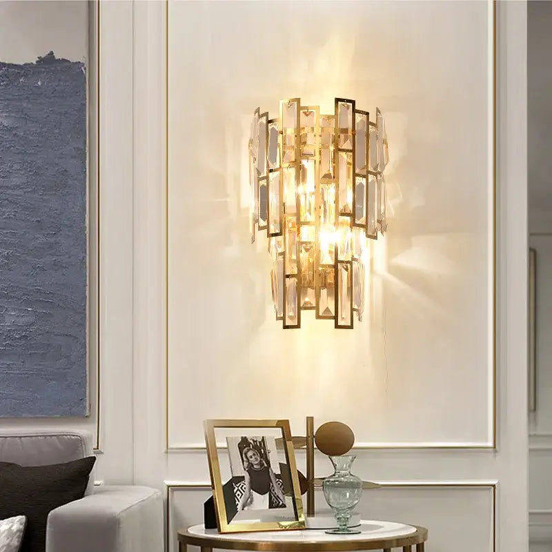 Elegant gold crystal wall lamp with rectangular crystal panels and glass rods for modern living room decor