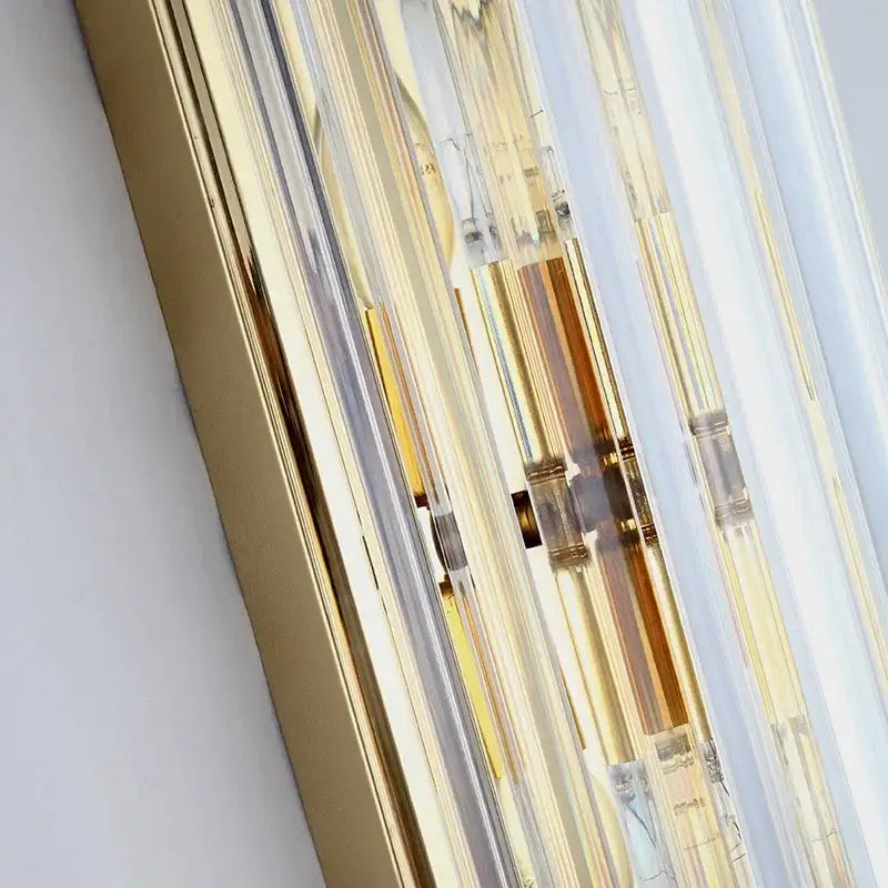 Elegant gold crystal wall lamp featuring vertical gold and clear acrylic rods with brass fittings for stylish decorbites crystal wall decor