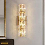 Elegant gold crystal wall lamp featuring stacked crystal segments and a metal frame for living room decorbites crystal wall lamp