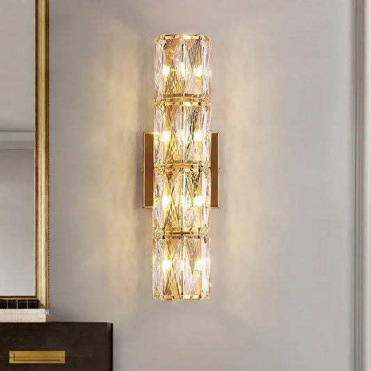 Elegant gold crystal wall lamp featuring stacked crystal segments and a metal frame for living room decorbites crystal wall lamp