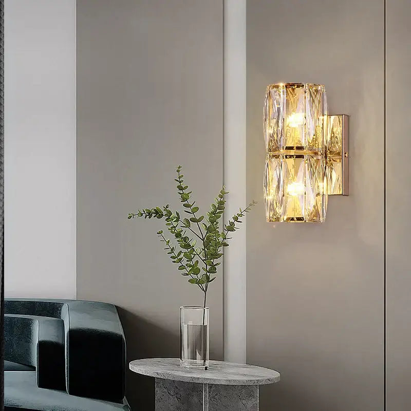 Elegant gold crystal wall lamp featuring faceted crystal accents as a decorbites crystal wall living room sconce