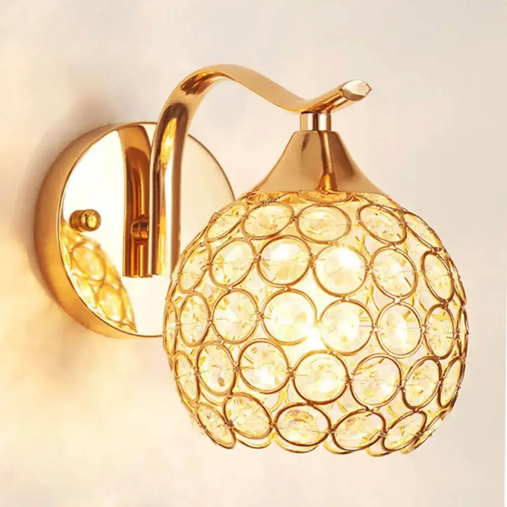 Elegant gold crystal wall sconce featuring a spherical globe design perfect for bedroom decorbites crystal wall lighting