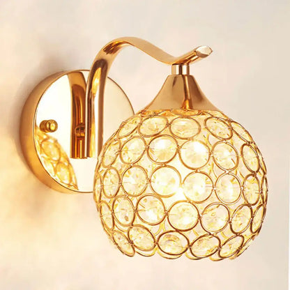 Elegant gold crystal wall sconce featuring a spherical globe design ideal for bedroom decorbites crystal wall lighting