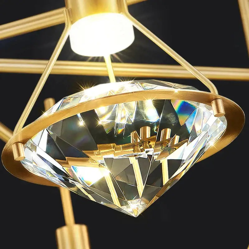 Elegant gold diamond crystal pendant light featuring a faceted crystal centerpiece for dining room illumination