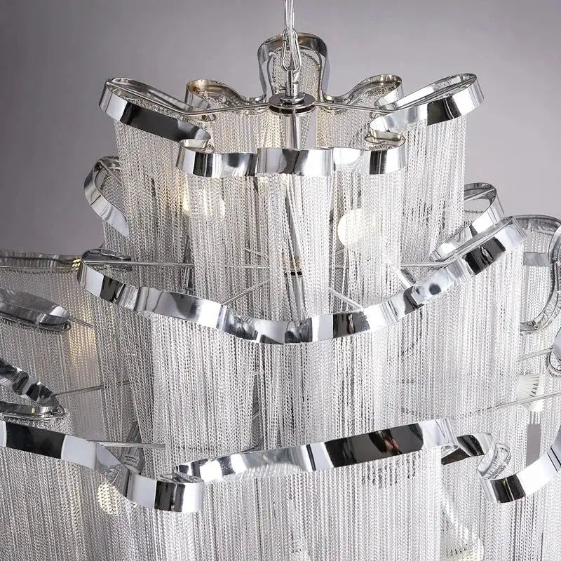 Elegant gold glass decorbites fringed chandelier with cascading silver chains and polished chrome rings for dining room