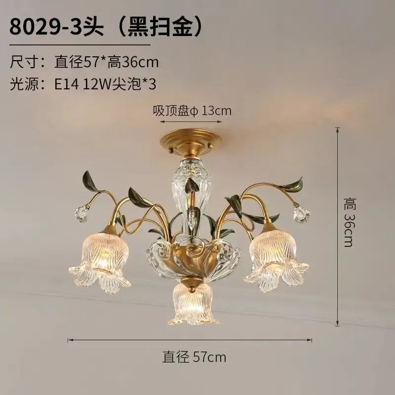 Black-gold finished three-light glass flower chandelier with ornate floral design and clear glass bell-shaped shades