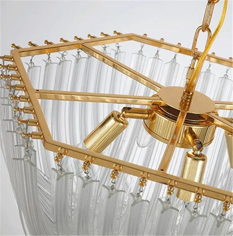 Elegant gold glass tube pendant chandelier with geometric frame, clear crystal strands, and star-shaped accents for dining rooms
