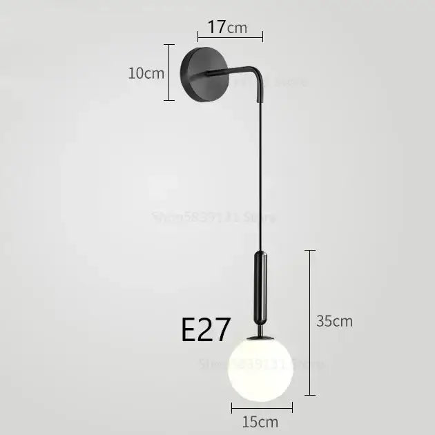 Black modern wall lamp with sleek curved arm and frosted glass globe bulb for decorbites elegant glass wall decor
