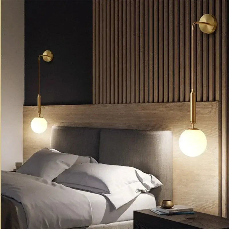 Elegant gold glass wall lamp featuring gold-toned sconces with frosted globe shades for living room decorbites elegant glass