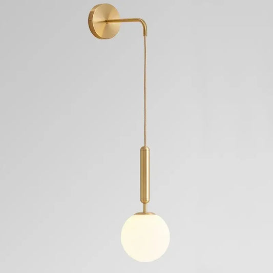 Elegant gold glass wall lamp with frosted globe shade and curved arm for living room decor by decorbites elegant glass