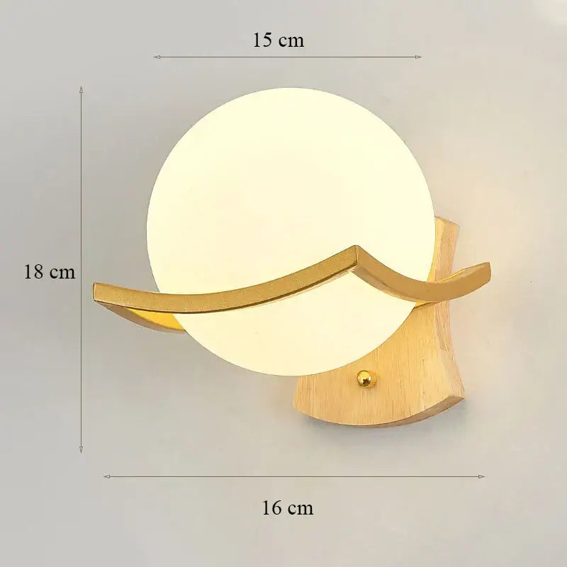 Elegant gold iron wall lamp with frosted glass shade and wood base as a modern decorbites iron wall lamp for bedroom
