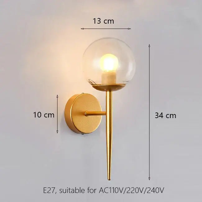 Elegant gold iron wall lamp with frosted glass shade featuring a gold-toned wall sconce and clear glass globe for bedroom decorbites iron wall lamp