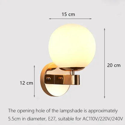 Elegant gold iron wall lamp with frosted glass shade featuring a gold-toned iron wall lamp for bedroom decorbites