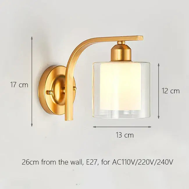 Elegant gold iron wall lamp with a curved arm and clear glass shade for bedroom decorbites iron wall lamp